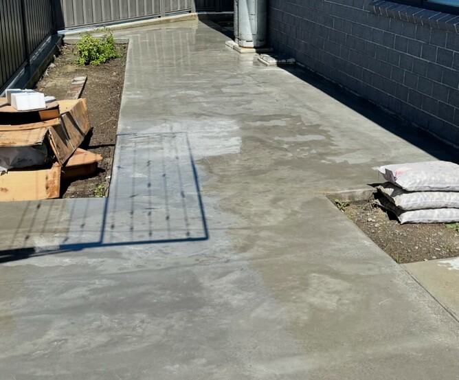 Concrete path down side of home