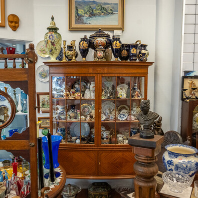 cabinet of antique porcelain and vases at Rotorua Antiques & Collectables