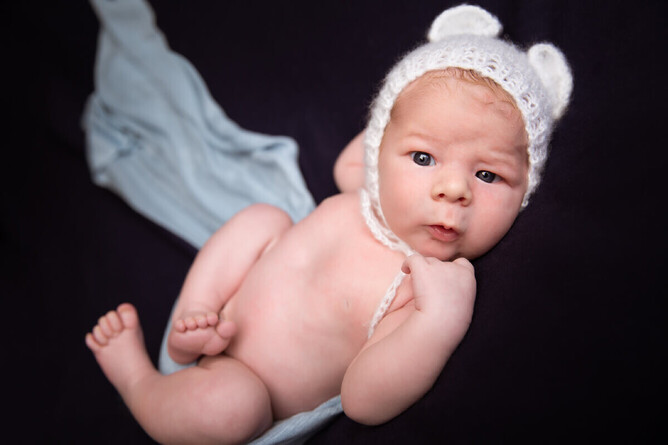 Awake newborn baby boy in Mel Waite Photography studio