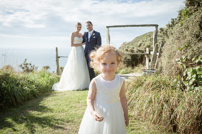 Photography of a small flowergirl with the bride and groom in a child frendly wedding by Mel Waite Photography
