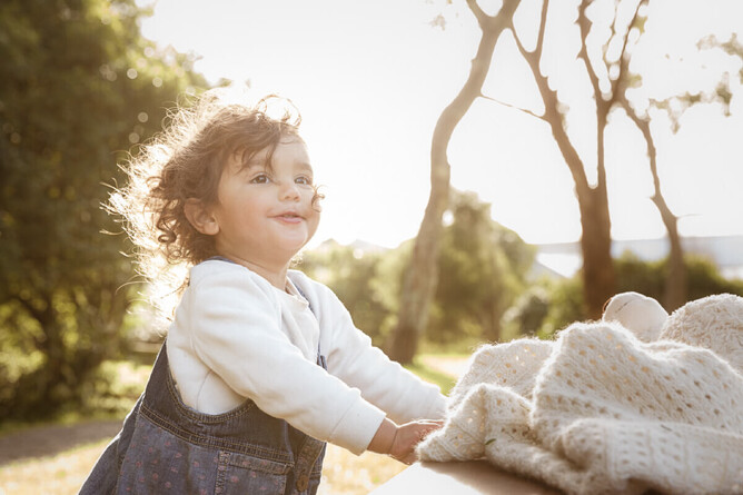 sun lite photograph of small girl on a winters day family photo shoot