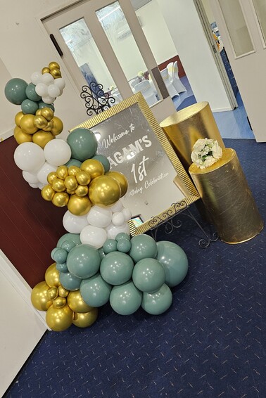 Custom welcome signage and balloon garland