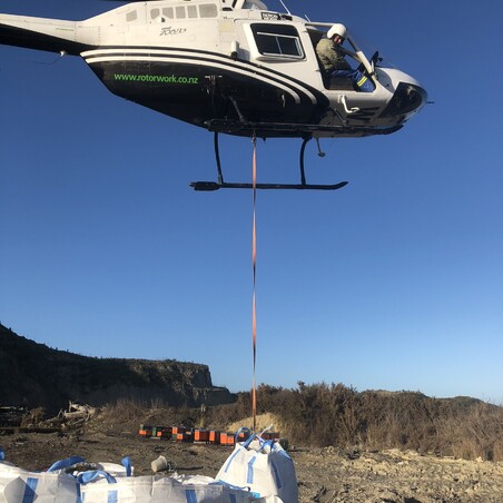 helicopter over truck on farm