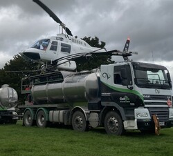 Helicopter spraying fertiliser