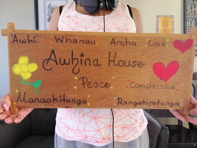Sign produced by Awhina House in lockdown reads 'Awhi, Whanau, Aroha, Love, Awhina House, Peace, Compassion, Manaakitanga, Rangatiratanga