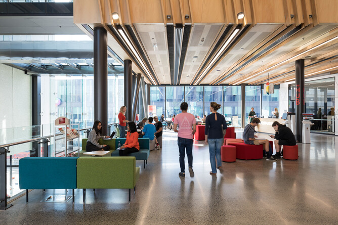 Students walk and sit inside Tauranga Tertiary campus building