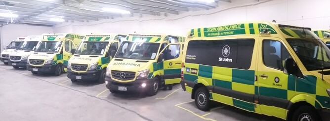 Seven ambulances parked inside the new St John building