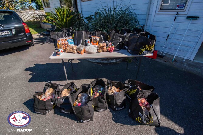 13 food parcels in reusable shopping bags