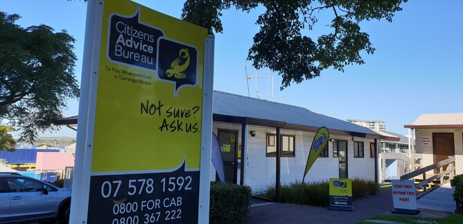 Citizens Advice Bureau roadside sign showing logo and phone number