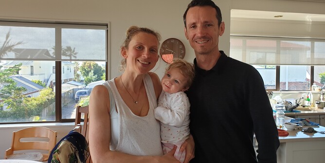 Susan and James Mooney holding child Maggie