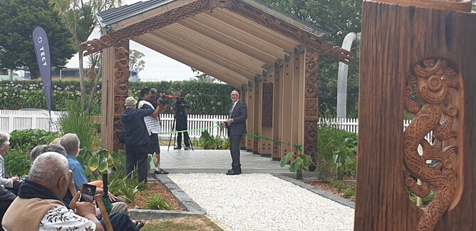 TECT Chairperson Bill Holland cuts the ribbon, opening The Elms TECT Heritage Garden