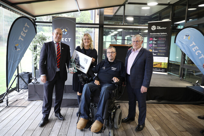 Bryce Dinneen receives award from Mayors