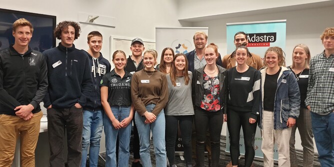 Adastra Scholarship recipients pose with Eric Murray
