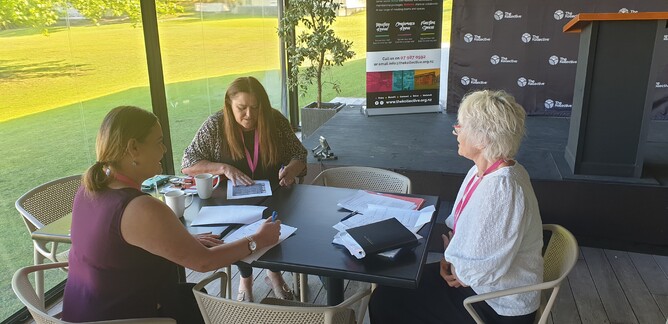 FAB Social Workers Carrie Matkovich and Rhonda McPhee with FAB Manager Heather Johnston working at The Kollective