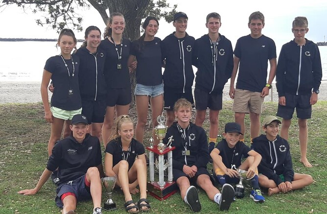 13 young people pose with awards