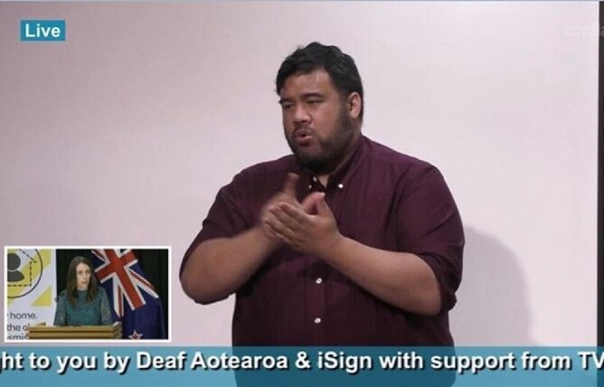 NZSL Interpreter on TV screen