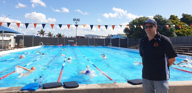 Head coach Andy McLay stands by pool as children swim