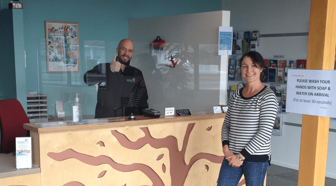 Katikati Community Centre Manager Allan Wainwright and Youth Counsellor, Suzanne Daly, pose with new perspex screen