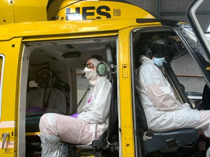 TECT Rescue Helicopter staff in full PPE sit in the helicopter