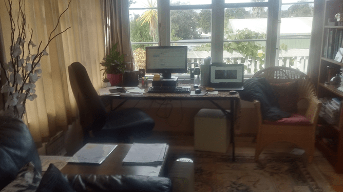 A home office including laptop, chair and desk