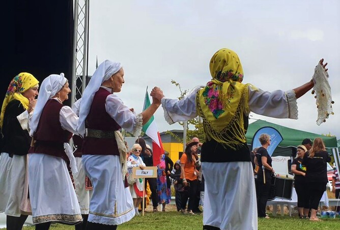 Four women dance in traditional costume
