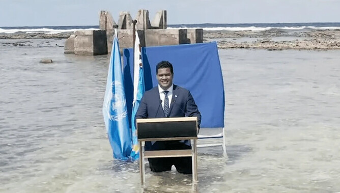 Tuvalu Foreign Minister Simon Kofe delivers a message to COP26, in 2021 / Image: TheSpinoff