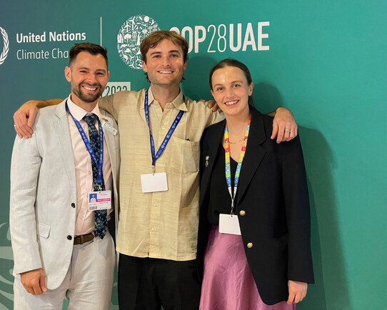 Three Kiwis in Climate members networking at COP28