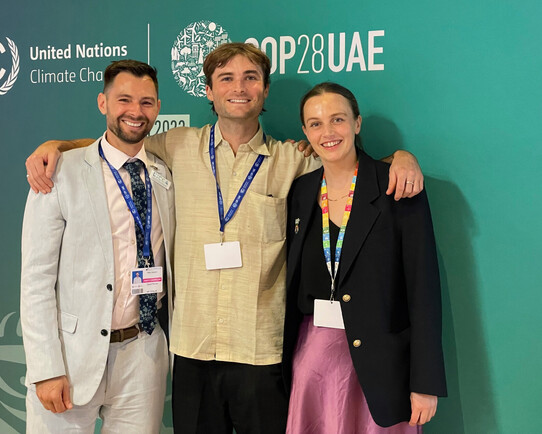 Three Kiwis in Climate members networking at COP28