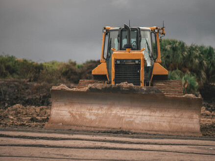 A stock image of a bulldozer in mud