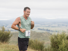 Trail runner, all smiles at blazing hills, on top of a hill with all the views