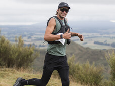 Trail runner, all smiles at blazing hills, on top of a hill with all the views . Sunglasses and happiness while running