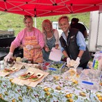 Catie and her team making the most delicious mutton sandwiches complete with homemade relish, salads, and a smile  