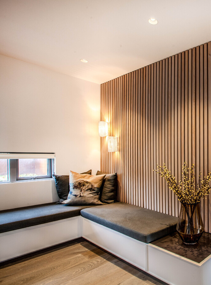 Nook with seated area and natural timber vertical wall feature