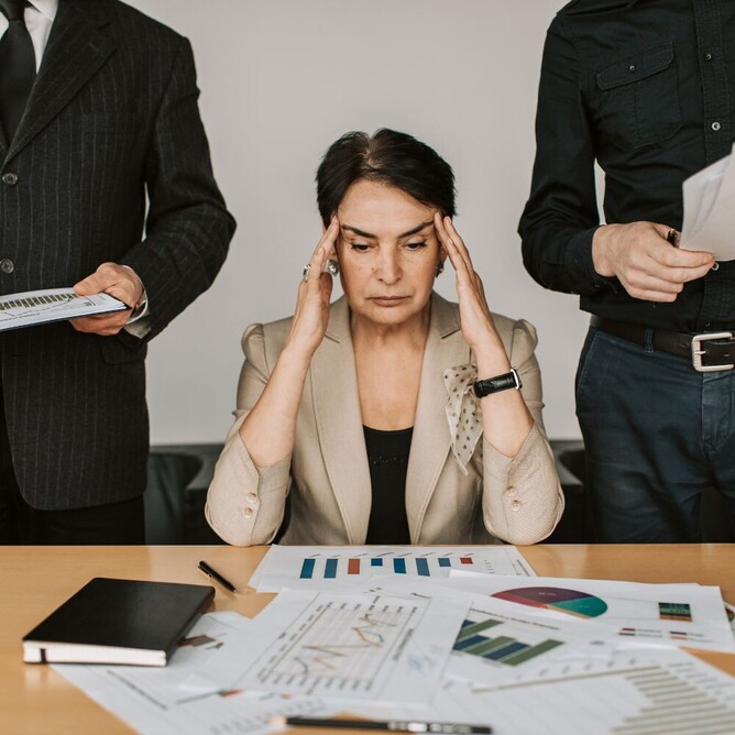 woman under pressure in stressful meeting