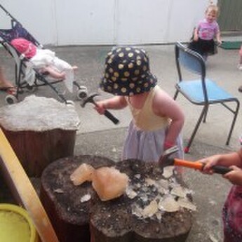 Sprouts girl hammering