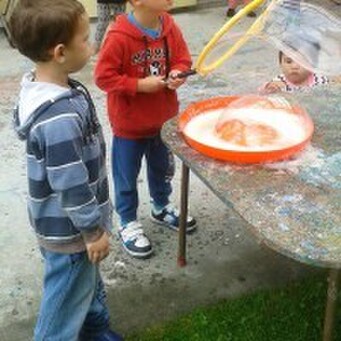 Sprouts Children playing with bubbles