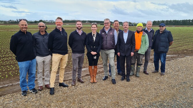 Associate Minister of Agriculture Nicola Grigg and MP for Port Waikatot Andrew Bayley - with members of the Pukekohe Vegetable Growers Association.