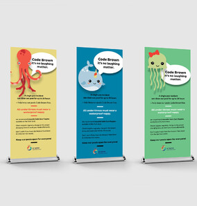 Kaz - Design. Brand. Web creating pull up banners for Taupo District Council