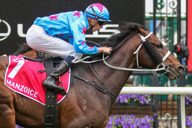 Mick Dee is a picture of concentration on Manzoice as they take out a special Group One victory at Flemington - Photo: Bruno Cannatelli