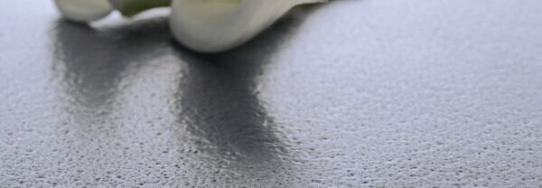 The brushed/leathered, or volcanic finish, has a rough appearance