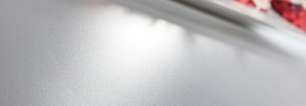 The honed finish, pictured above, is smooth with a less reflective shine