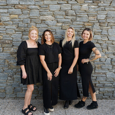 The Salon stylists standing together outside the Salon.