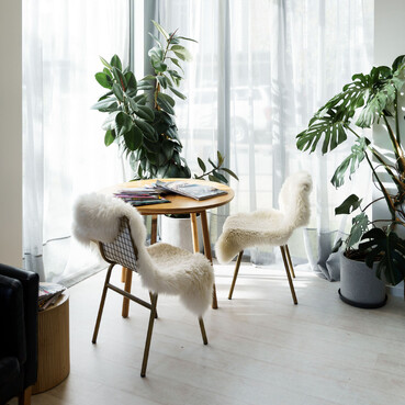 Relaxing table for clients to spend time at or work from in The Salon.