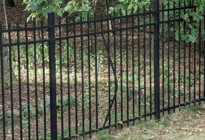 this aluminium fence panel has sustained damage due to vandalism