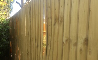 warping in panels of a wooden fence