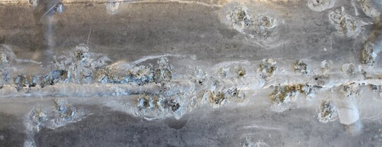 pitting corrosion in an aluminium panel around a weld