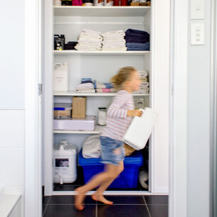 Editorial photography for Living Lightly book by Nicola Turner laundry linen cupboard bulk