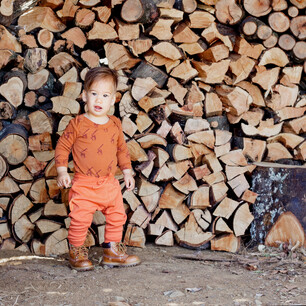 Childrens fashion photography for Kauri and Sons firewood stack location