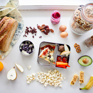 Editorial photography for Living Lightly book by Nicola Turner flatlay of kids lunchbox food ideas