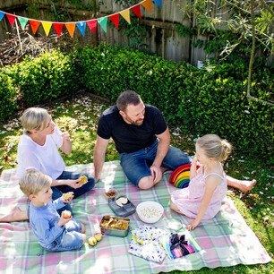 Editorial photography for Living Lightly book by Nicola Turner family outdoor picnic celebration